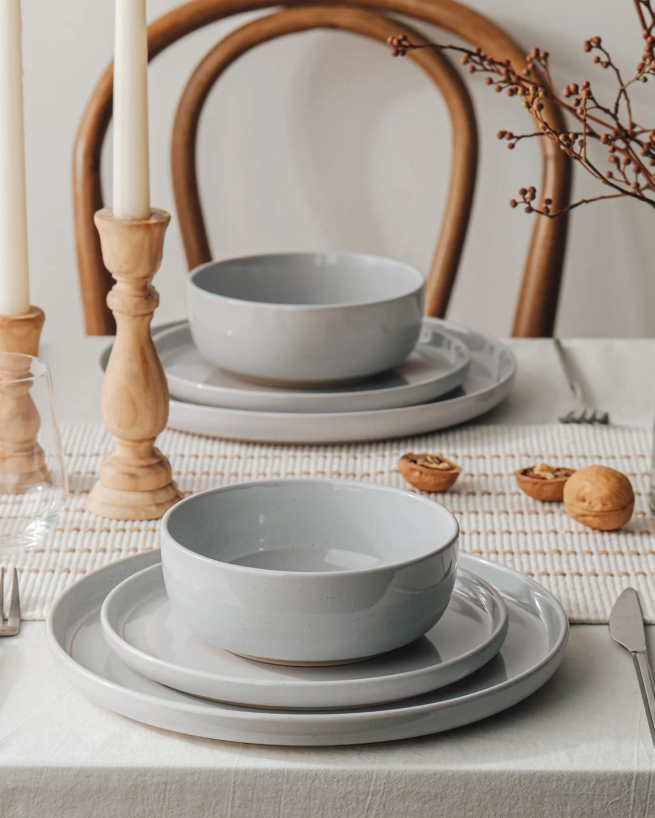 A Famiware table set with plates, bowls and candles
